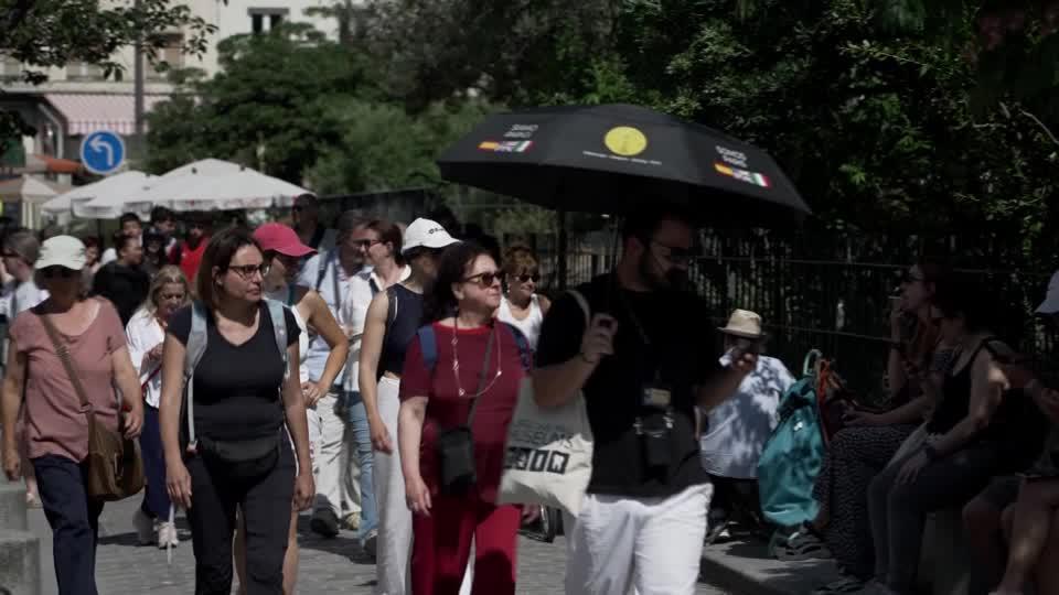 Tourists cool off by Paris fountains in France’s heatwave
